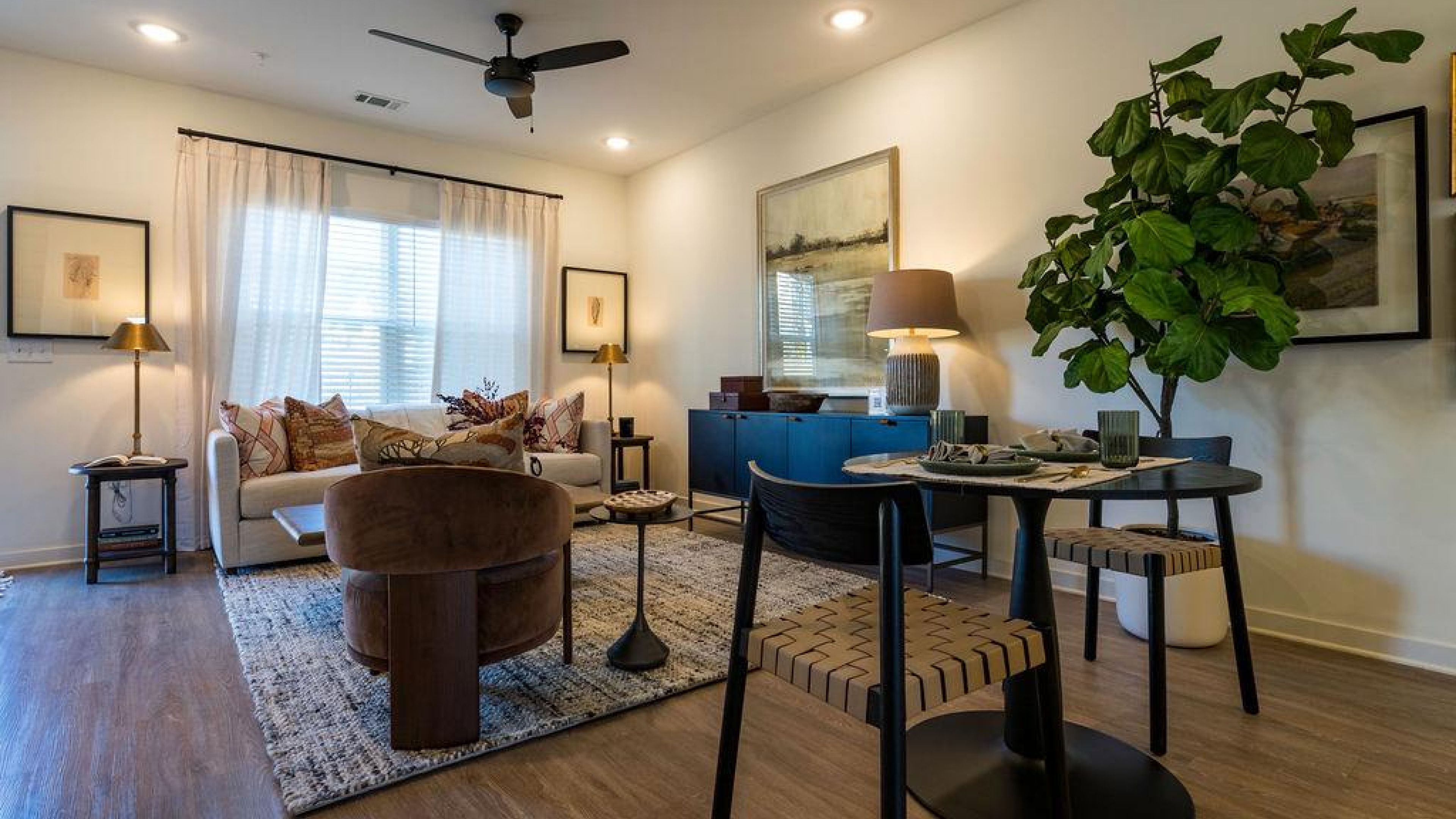 Encore at Reems Creek apartment kitchen area with wrap around kitchen island, stainless steel appliances, and ample cabinet storage