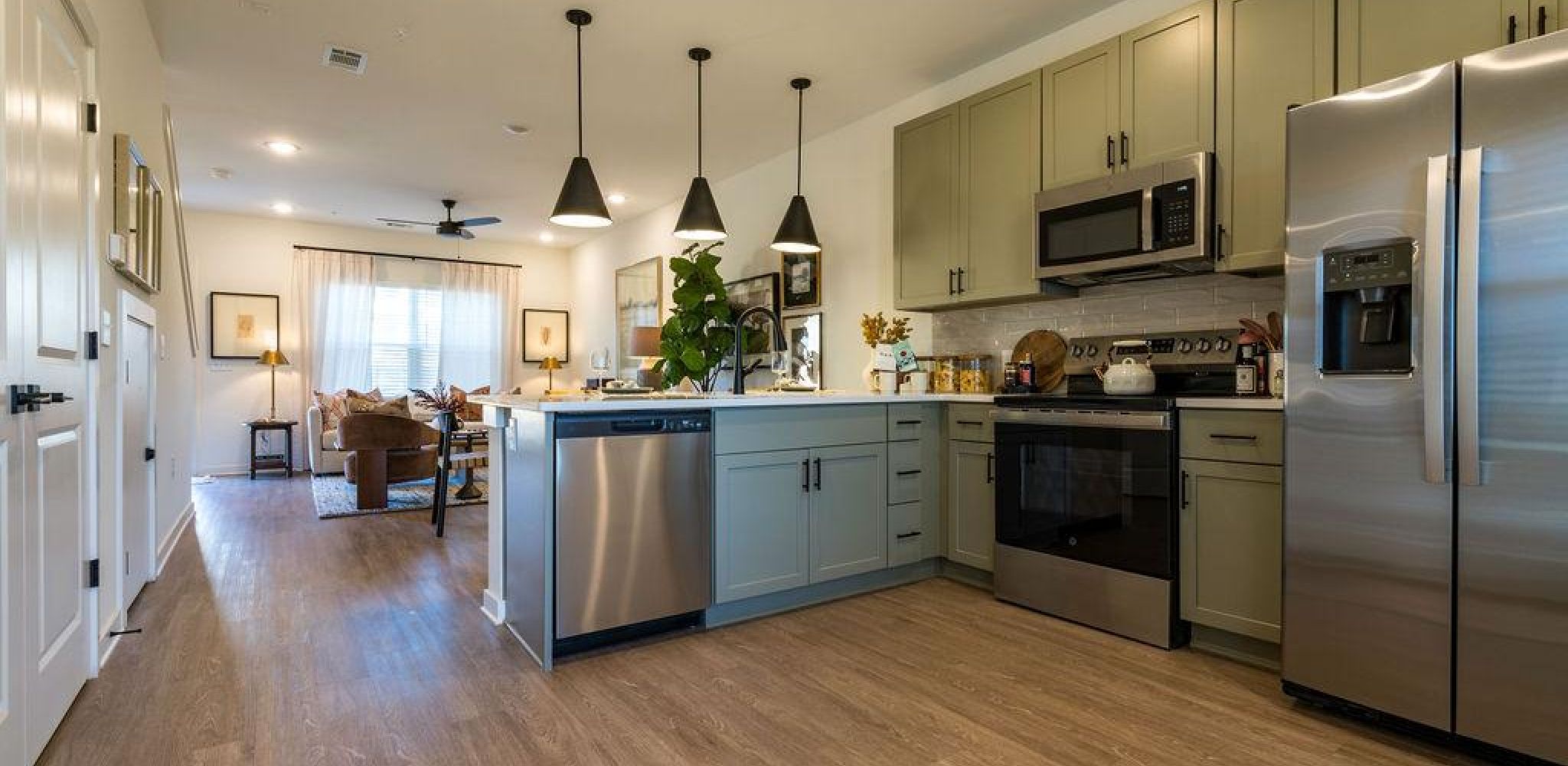 Encore at Reems Creek family laying in bed laughing together